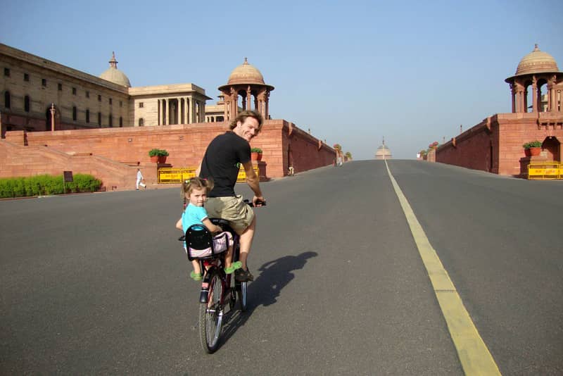 A tourist taking a cycling tour of Delhi
