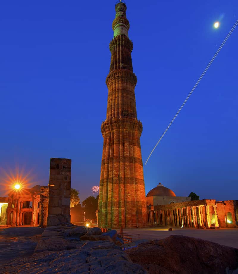 The massive monolith of Qutub Minar at night