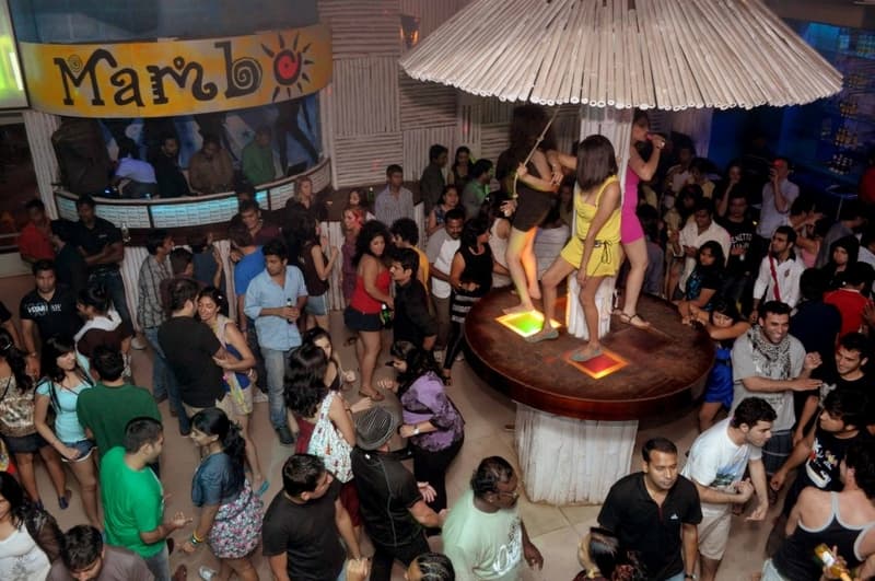 Party with a fun-loving crowd at Café Mambos