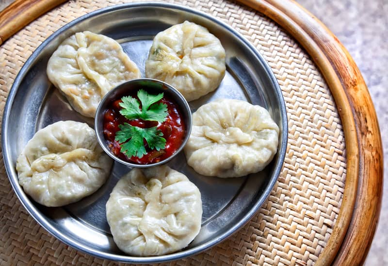 Momos served with sauce in a Platter