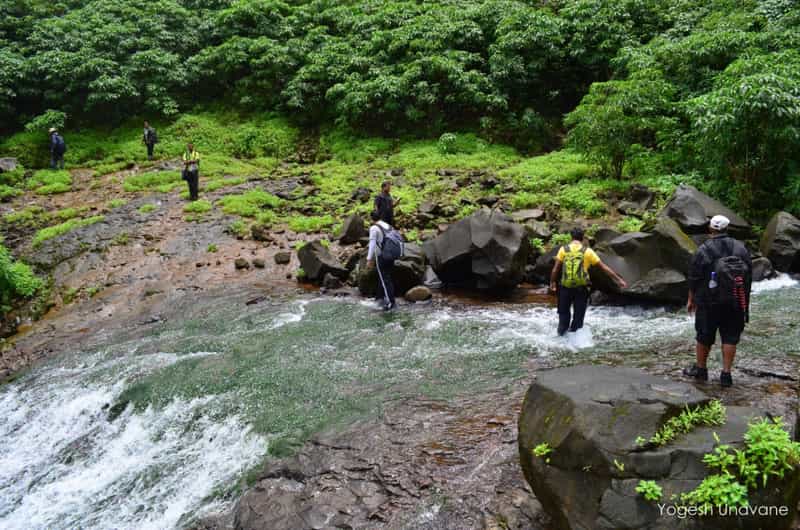  Trekkers crossing stream on Andharban Trek