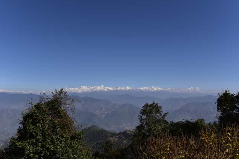 Enjoy stunning views of the snow clad Himalayas from Kanatal