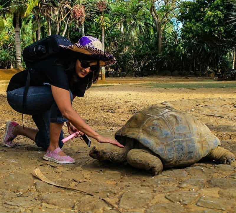Ami petting a tortoise in Mauritius