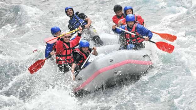 Patrons engaging in whitewater rafting