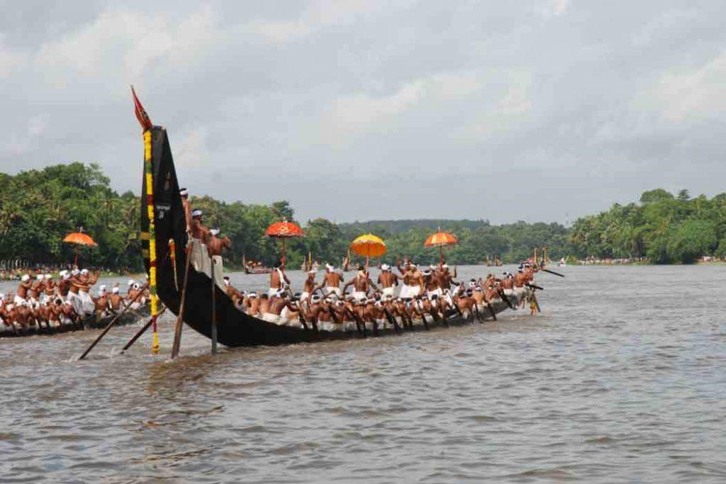 Enthusiastic boat riders racing in the Pampa river at Champakulam. 