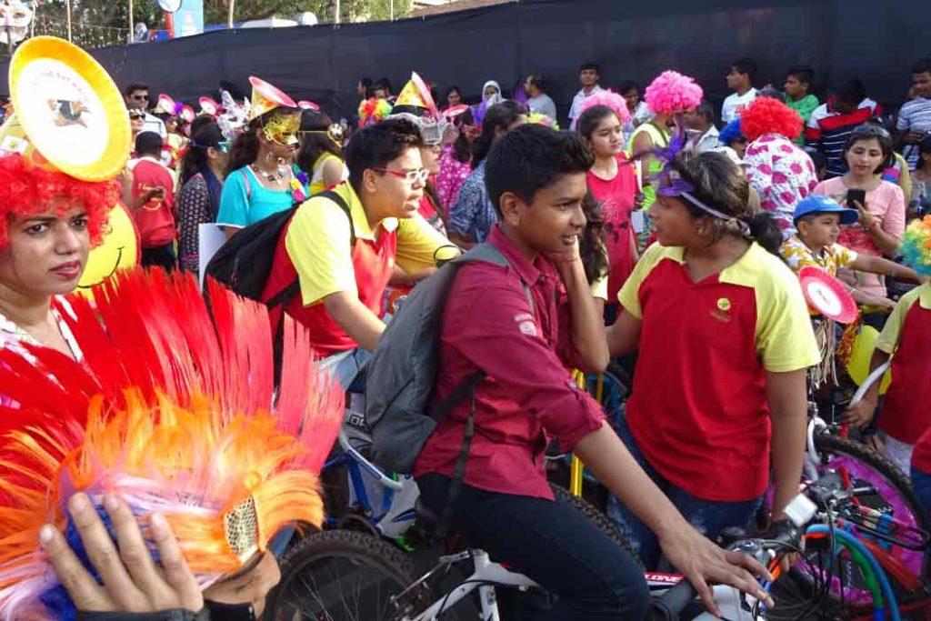 People dress up in colorful costumes and participate in the fun events at Goa carnival. 