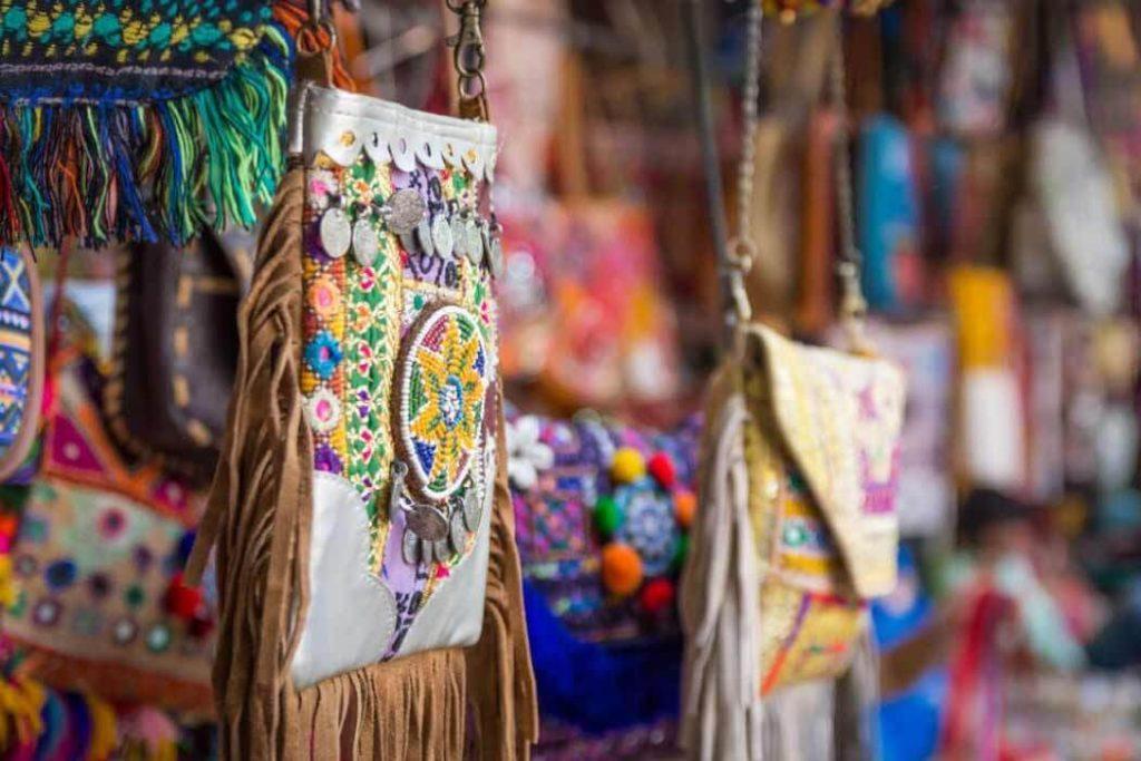 Boho bags hanging at a vendor's stall in Janpath.