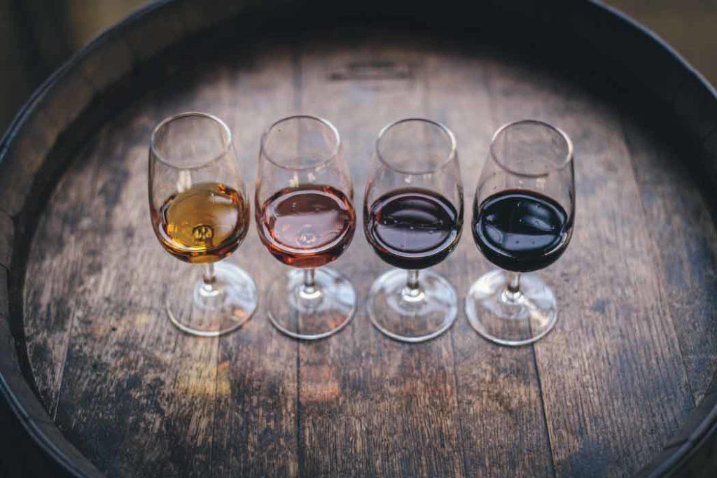 Four varieties of wine kept on a barrel. 