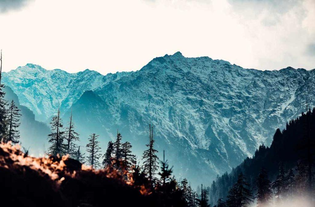 Manali is heaven on Earth with pine trees and snow capped mountains and is a must visit on your summer vacation 