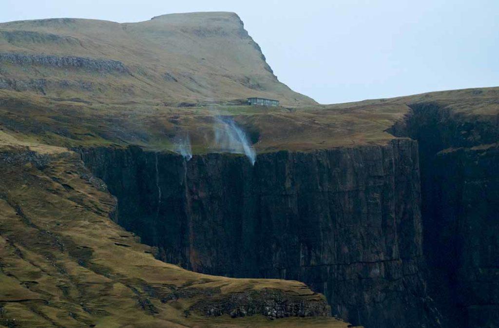 When there is a heavy downpour in the region, the Reverse waterfall water flows down the hills and cliffs surrounding Tiger Point. 