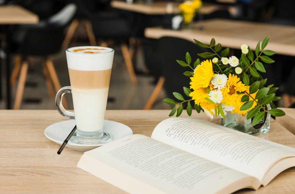 A relaxing ambiance at Artsy cafe, one of the book cafes in India with comfortable seating and books