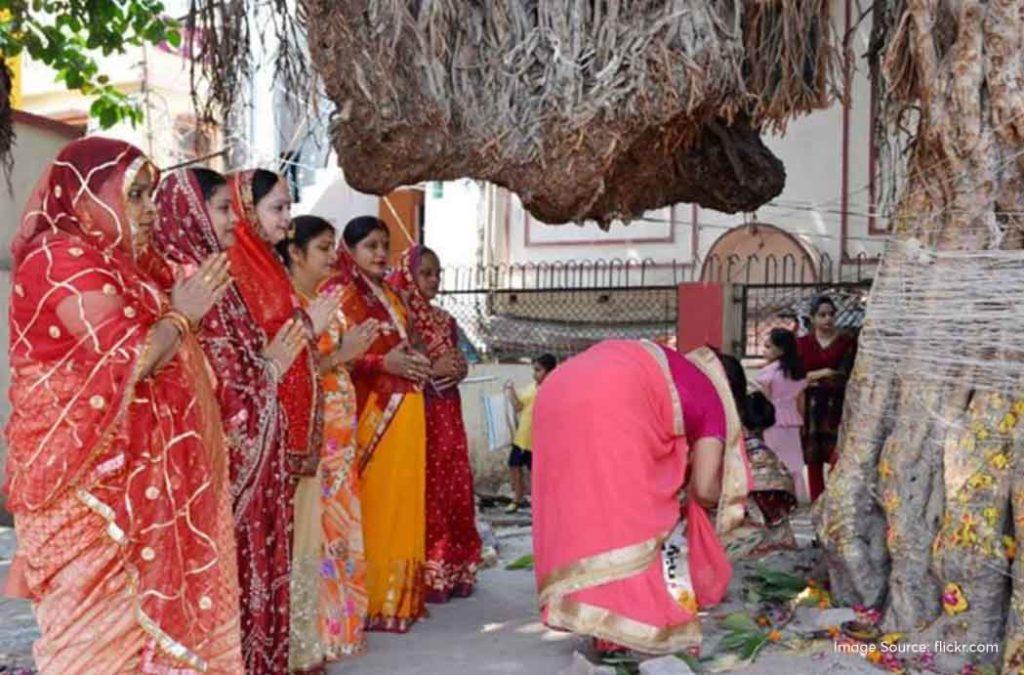 Women dress up in their wedding attires on the day of Vat Savitri Puja. 