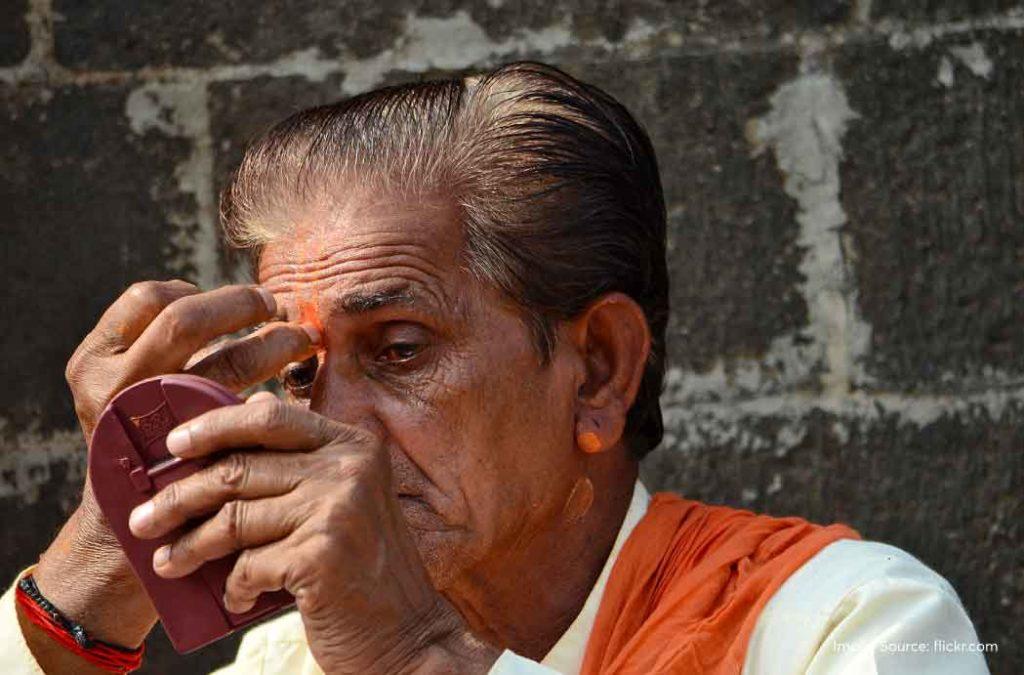 Devotees apply Tilak on Shattila Ekadashi.